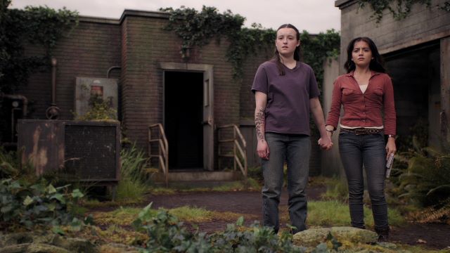 alt="Ellie and Dina holding hands on seattle rooftop.jpg"