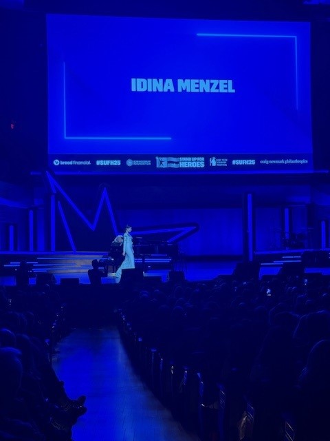 alt="Idina Menzel walking onstage.jpg"