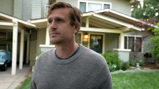 alt="Jason Segal as Jimmy Laird looking out across the street in Shrinking"