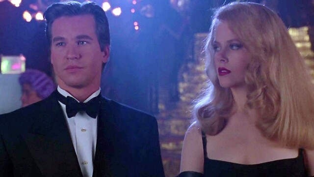 alt="Val Kilmer as Bruce Wayne alongside Nicole Kidman in Batman Forever, a 1995 superhero film"